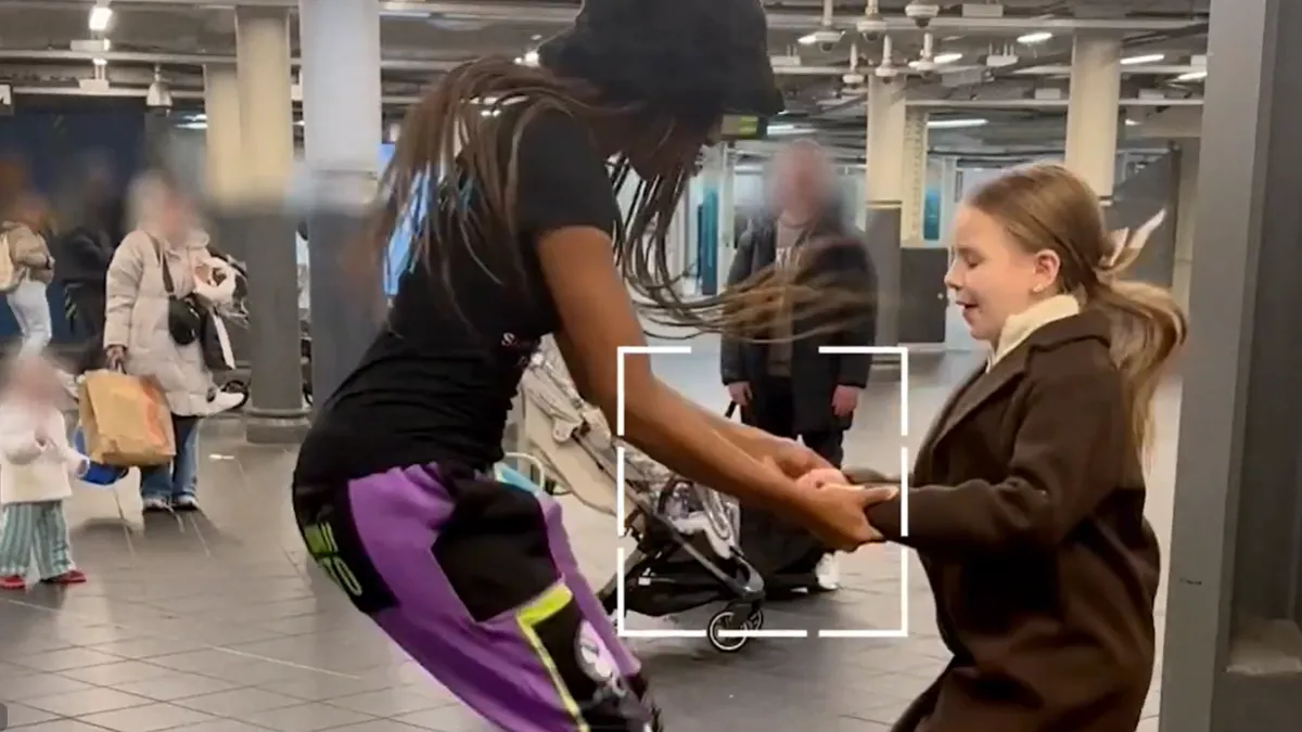 Woman and girl jumping rope together in a subway station